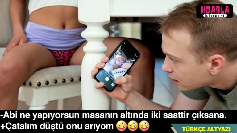 adi serefsiz masanin altinda bacisinin amini foto cekiyor.jpg
